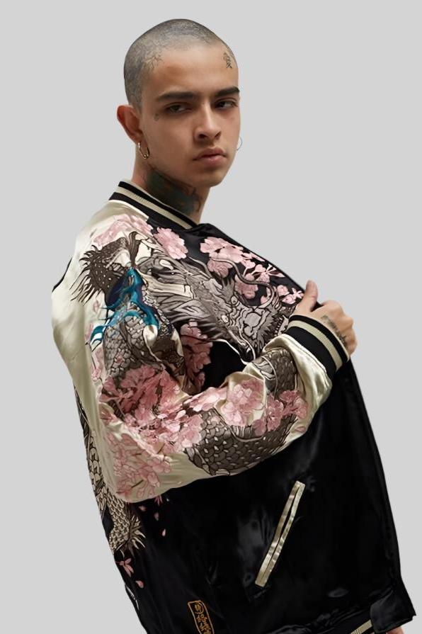 A model wearing the Dragon's Sakura sukajan jacket from Sukajan Mall, showcasing the stylish design and vibrant details of the jacket.