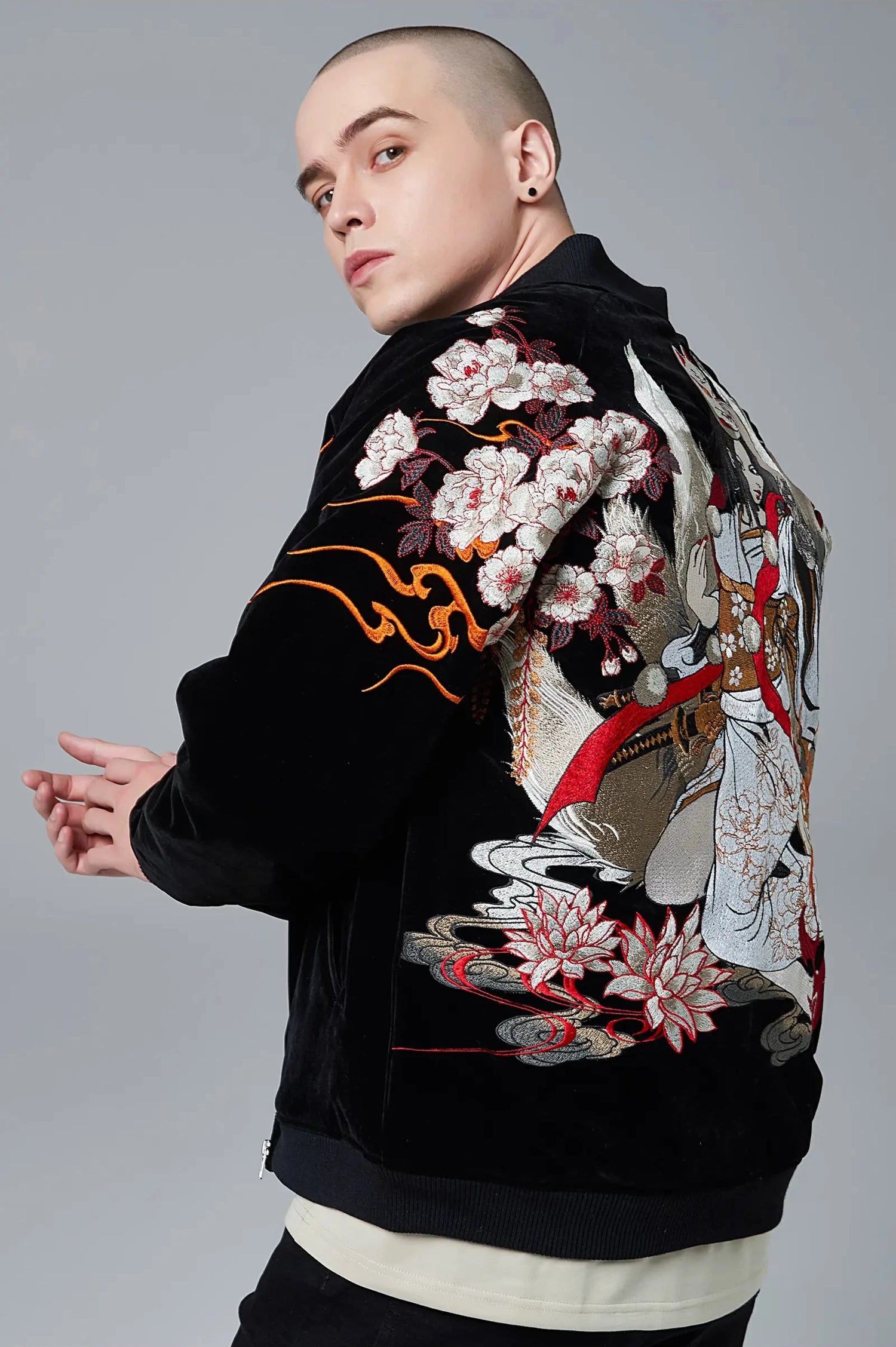 Side view of a model wearing the insulated Nine Tailed Fox sukajan jacket from Sukajan Mall.